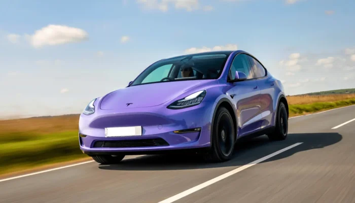 Tesla driving on the UK road in the sunshine