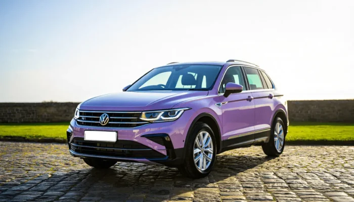 Purple VW parked in the countryside on a sunny day