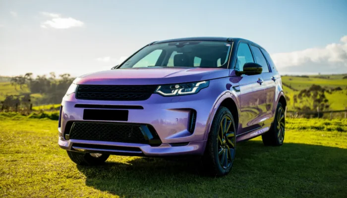 Purple Land Rover in the country