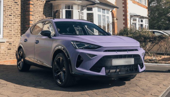 A light purple cupra parked on a driveway in front of a house in the united kingdom