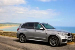 Grey BMW parked up on a coastal road in the United Kingdom