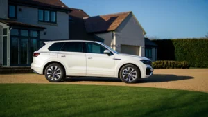 white VW SUV sitting outside a house in the United Kingdom on a sunny day