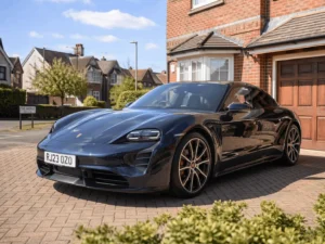 Porsche sitting on the driveway in good weather conditions