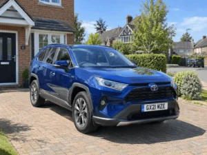 Blue Toyota parked on driveway
