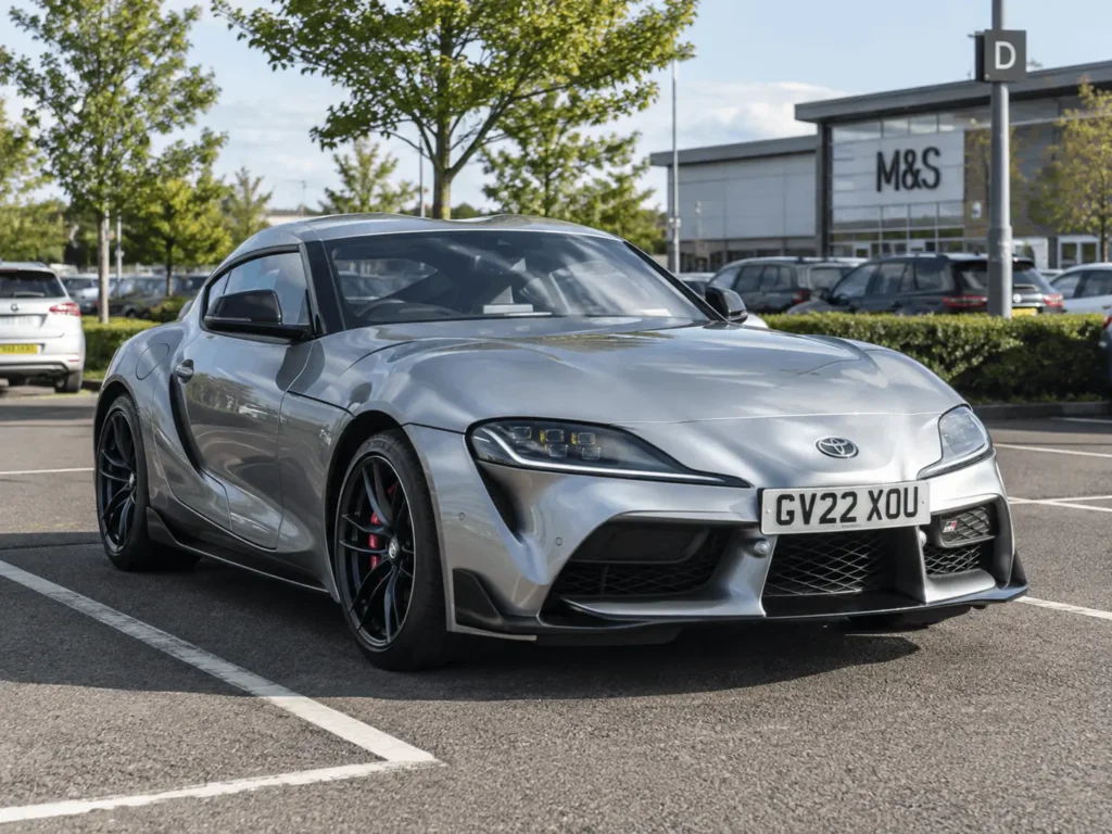 grey toyota parked in shopping car park